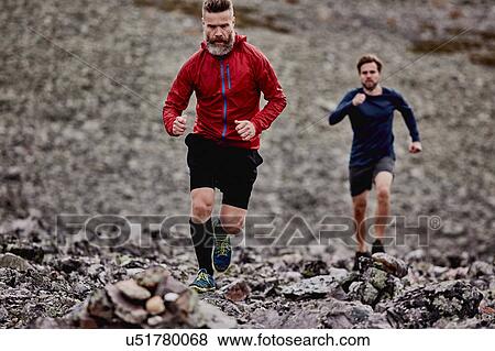 Men running on rocky cliff top, Kesankitunturi, Lapland, Finland View Large Photo Image Stock Photo - Men running on rocky cliff top, Kesankitunturi, Lapland, Finland. Fotosearch