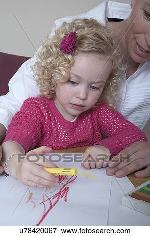 Mother and daughter (4-5) drawing with crayons View Large Photo Image Stock Photo - Mother and daughter (4-5) drawing with crayons. Fotosearch