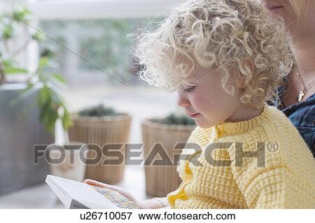 Mother and daughter (4-5) reading book View Large Photo Image Stock Photo - Mother and daughter (4-5) reading book. Fotosearch