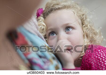 Stock Image - Mother holding daughter (4-5). Fotosearch