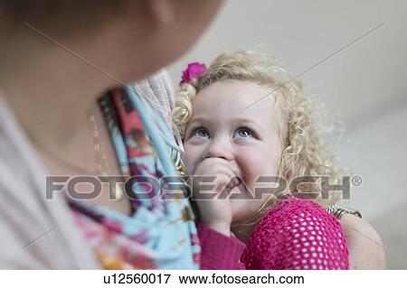 Mother holding daughter (4-5) View Large Photo Image Stock Photo - Mother holding daughter (4-5). Fotosearch