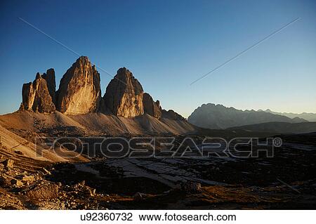 Stock Image - Mountain landscape at sunset, Dolomites, Sexten, South Tyrol, Italy. Fotosearch