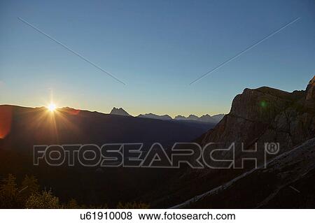 Stock Photo - Mountain landscape with silhouetted Dolomites, Sexten, South Tyrol, Italy. Fotosearch