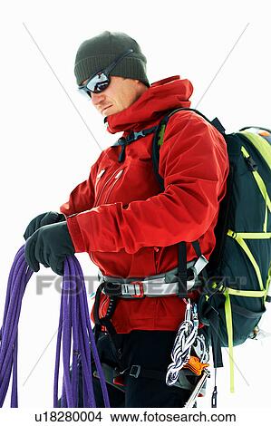 Mountaineer preparing climbing ropes View Large Photo Image Picture - Mountaineer preparing climbing ropes. Fotosearch