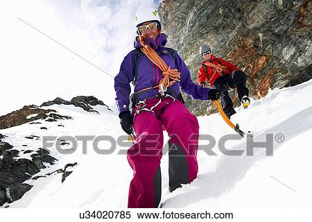 Mountaineers descending snow-covered mountain, Saas Fee, Switzerland View Large Photo Image Stock Photography - Mountaineers descending snow-covered mountain, Saas Fee, Switzerland. Fotosearch