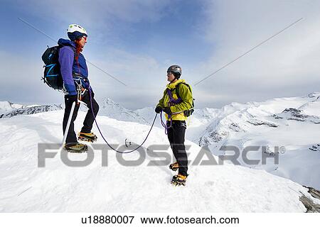 Mountaineers on top of snow-covered mountain, Saas Fee, Switzerland View Large Photo Image Stock Photo - Mountaineers on top of snow-covered mountain, Saas Fee, Switzerland. Fotosearch