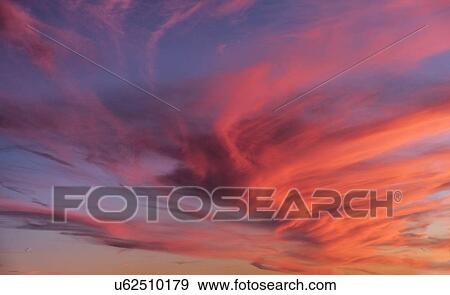Stock Photo - Multi colored dramatic sky. Fotosearch