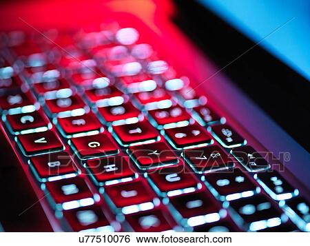 Night-lit laptop computer focusing on the keyboard View Large Photo Image Stock Photograph - Night-lit laptop computer focusing on the keyboard. Fotosearch