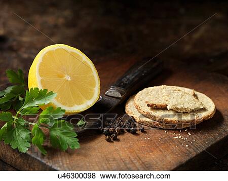 Oat biscuits, peppercorns, half a lemon and coriander View Large Photo Image Stock Photo - Oat biscuits, peppercorns, half a lemon and coriander. Fotosearch