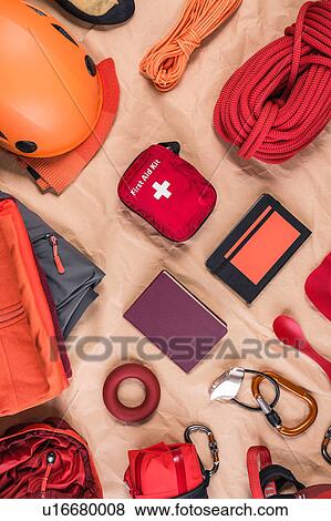 Stock Photo - Overhead view of climbing equipment with climbing helmet, first aid kit and climbing ropes. Fotosearch