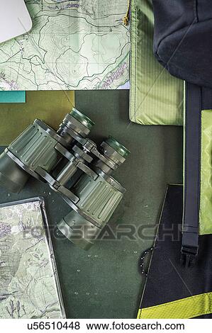 Overhead view of folding map and binoculars on table View Large Photo Image Stock Photo - Overhead view of folding map and binoculars on table. Fotosearch