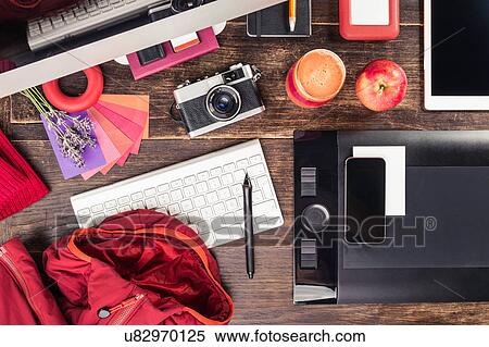Overhead view of photo editing equipment; graphic tablet, digital tablet, retro camera, smartphone and desktop computer View Large Photo Image Stock Photography - Overhead view of photo editing equipment; graphic tablet, digital tablet, retro camera, smartphone and desktop computer. Fotosearch