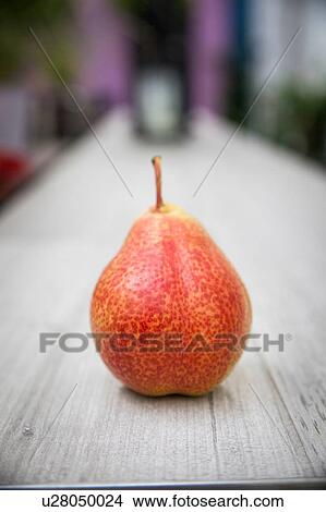 Picture - Pear standing on table. Fotosearch