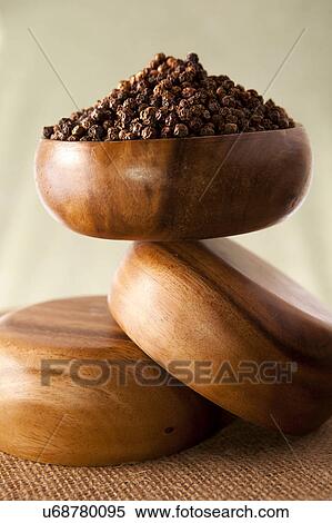 Stock Photography - Peppercorns in wooden bowl. Fotosearch