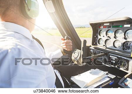 Pilot in cockpit of aircraft View Large Photo Image Stock Photograph - Pilot in cockpit of aircraft. Fotosearch