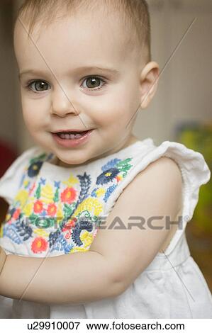Portrait of baby girl (18-23 months) View Large Photo Image Stock Photo - Portrait of baby girl (18-23 months). Fotosearch