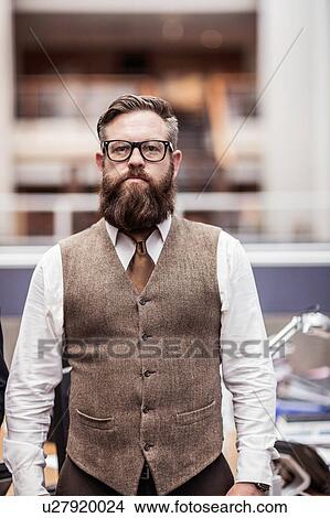 Portrait of bearded businessman in office wearing tweed waistcoat View Large Photo Image Picture - Portrait of bearded businessman in office wearing tweed waistcoat. Fotosearch
