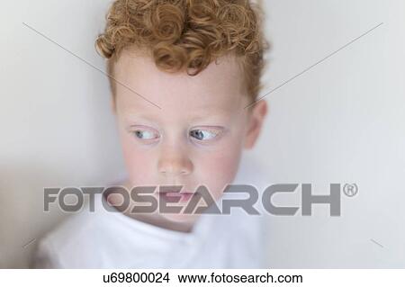 Picture - Portrait of boy (8-9) with red hair. Fotosearch