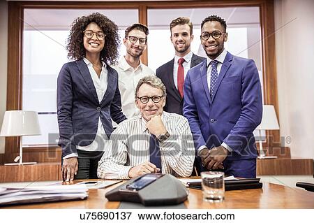 Stock Photo - Portrait of businesswoman and four businessmen in boardroom. Fotosearch