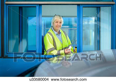 Portrait of female toll collector at toll booth on bridge View Large Photo Image Picture - Portrait of female toll collector at toll booth on bridge. Fotosearch