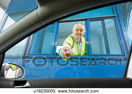 Portrait of female toll collector at toll booth on bridge View Large Photo Image Stock Photography - Portrait of female toll collector at toll booth on bridge. Fotosearch