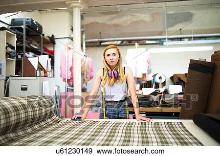 Portrait of female worker in leather jacket manufacturers View Large Photo Image Stock Photo - Portrait of female worker in leather jacket manufacturers. Fotosearch