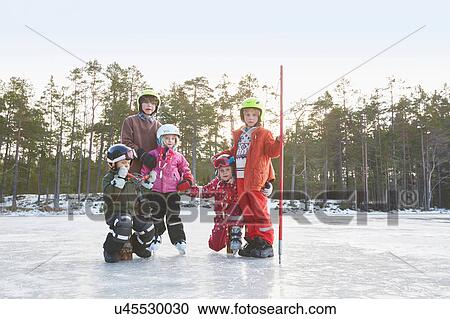Portrait of girls and boys wearing skiing helmets on frozen lake, Gavle, Sweden View Large Photo Image Stock Image - Portrait of girls and boys wearing skiing helmets on frozen lake, Gavle, Sweden. Fotosearch