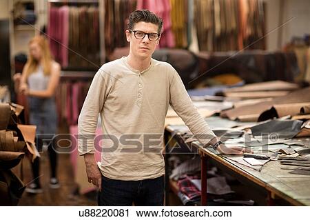 Portrait of male worker in leather jacket manufacturers, close-up View Large Photo Image Stock Image - Portrait of male worker in leather jacket manufacturers, close-up. Fotosearch