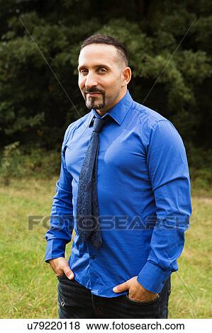 Stock Photo - Portrait of mature man, outdoors, smiling. Fotosearch