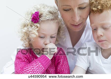 Portrait of mother with daughter (4-5) and son (8-9) View Large Photo Image Picture - Portrait of mother with daughter (4-5) and son (8-9). Fotosearch