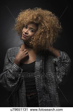 Portrait of smiling blond woman on black background View Large Photo Image Stock Image - Portrait of smiling blond woman on black background. Fotosearch
