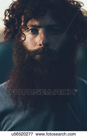 Portrait of staring, bearded young male hipster View Large Photo Image Stock Photo - Portrait of staring, bearded young male hipster. Fotosearch