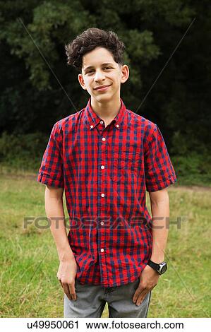 Portrait of teenage boy, outdoors, smiling View Large Photo Image Stock Image - Portrait of teenage boy, outdoors, smiling. Fotosearch