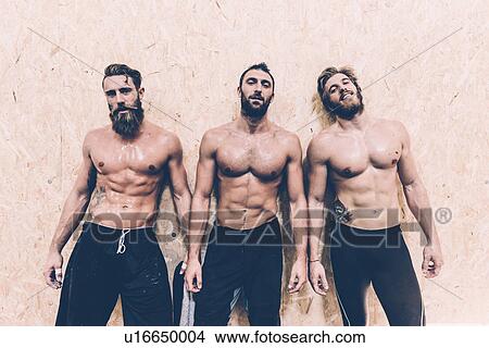 Portrait of three macho male cross trainers in gym View Large Photo Image Picture - Portrait of three macho male cross trainers in gym. Fotosearch