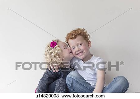 Stock Photo - Portrait of two siblings (4-5, 8-9). Fotosearch