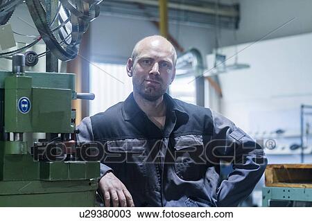 Portrait of worker in grinding workshop View Large Photo Image Stock Image - Portrait of worker in grinding workshop. Fotosearch