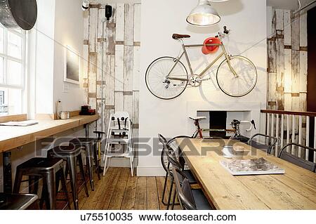 Quirky coffee shop interior with bicycle on wall View Large Photo Image Stock Photography - Quirky coffee shop interior with bicycle on wall. Fotosearch