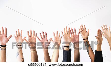 Raised hands against white background View Large Photo Image Stock Image - Raised hands against white background. Fotosearch