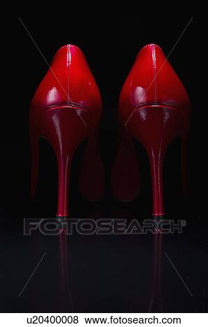 Stock Photo - Red shoes against black background. Fotosearch