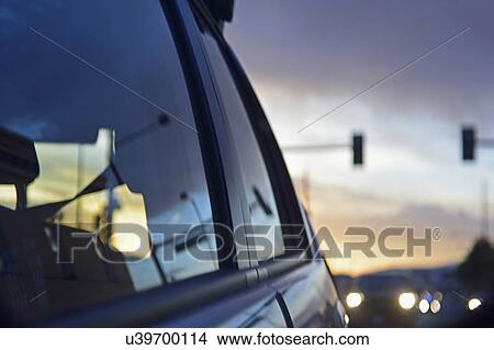 Reflections of city traffic in car's window View Large Photo Image Picture - Reflections of city traffic in car's window. Fotosearch