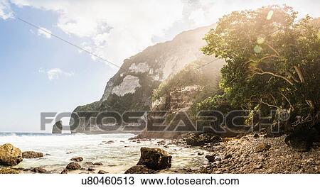 Stock Image - Rocky beach and rock formation, South Coast, Nusa Penida, Indonesia. Fotosearch