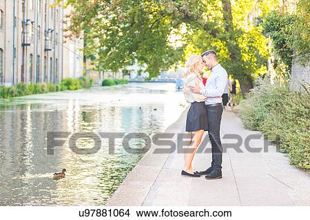 Romantic young couple face to face on Regent's Canal, London, UK View Large Photo Image Picture - Romantic young couple face to face on Regent's Canal, London, UK. Fotosearch