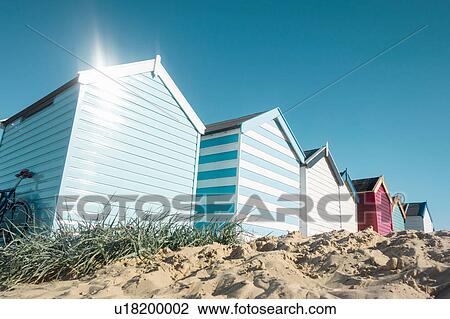 Stock Image - Row of beach huts, Southwold, Suffolk, UK. Fotosearch