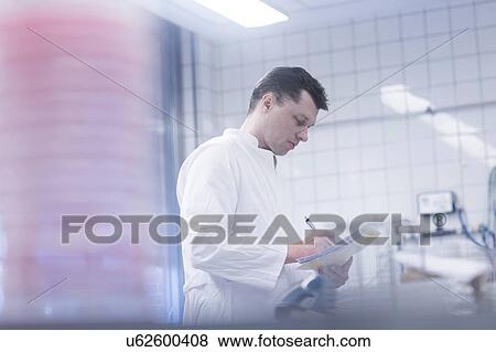 Stock Photo - Scientist working in laboratory. Fotosearch