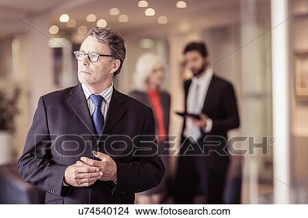 Senior businessman at meeting View Large Photo Image Picture - Senior businessman at meeting. Fotosearch