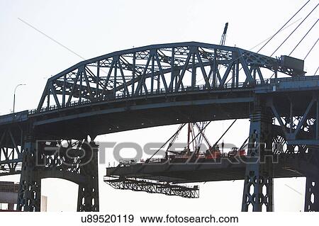 Stock Photo - Silhouette bridge against sky. Fotosearch