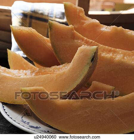 Slices of cantaloupe View Large Photo Image Stock Image - Slices of cantaloupe. Fotosearch