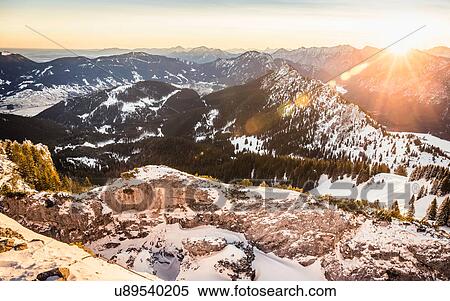 Stock Photography - Snow-covered mountain landscape at sunrise, Teufelstattkopf mountain, Oberammergau, Bavaria, Germany. Fotosearch