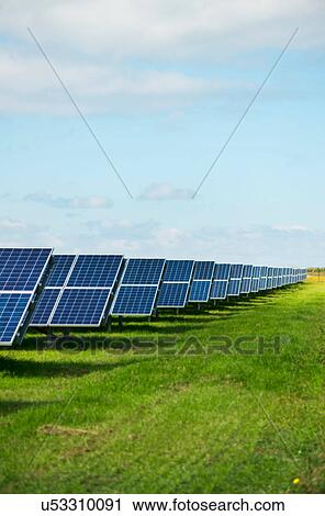 Stock Image - Solar panels in field, Ballum, Friesland, Netherlands. Fotosearch