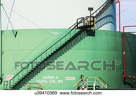 Stairs on wall of oil storage tank View Large Photo Image Stock Photo - Stairs on wall of oil storage tank. Fotosearch